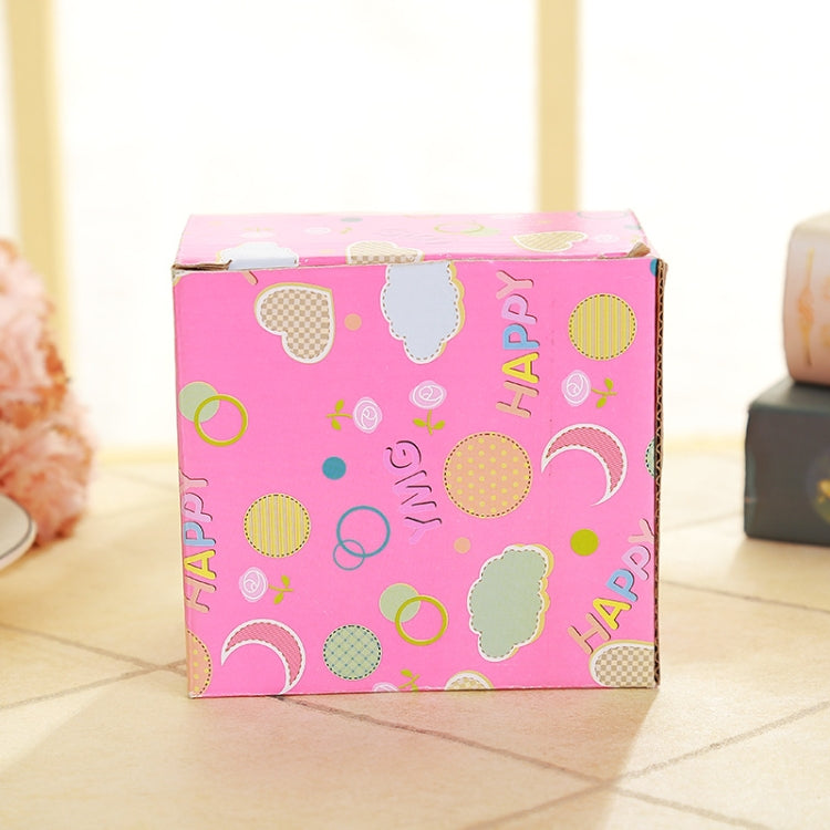 Decorative gift box labeled Happy, pink with multi-color circle and heart prints