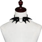 Black demon wing leather choker on mannequin with heart clasp and stud rivets