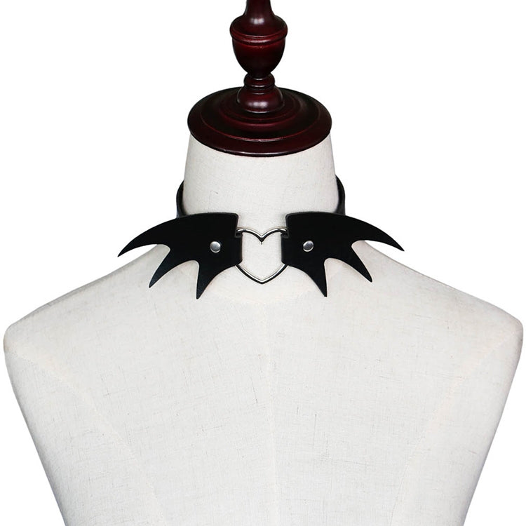 Black demon wing leather choker on mannequin with heart clasp and stud rivets