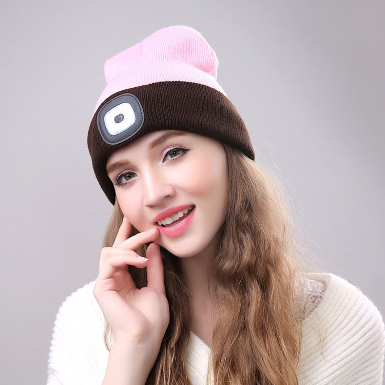 Brown knit winter beanie with glowing side LED light patch on a person