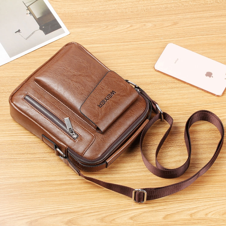 Brown leather-look messenger bag with front flap pocket and zipper closure; adjustable strap