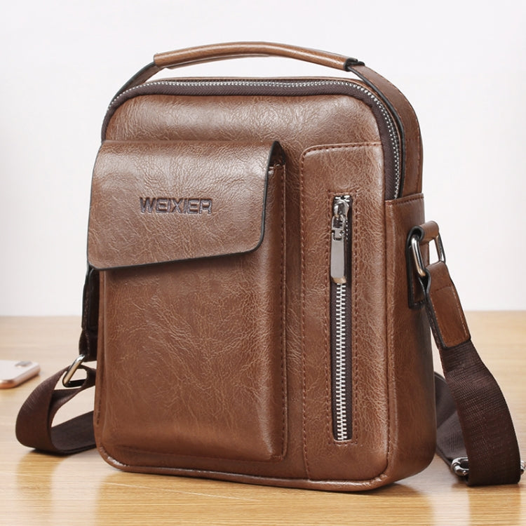 Brown leather-look messenger bag with front flap pocket, vertical zipper, and side strap hardware