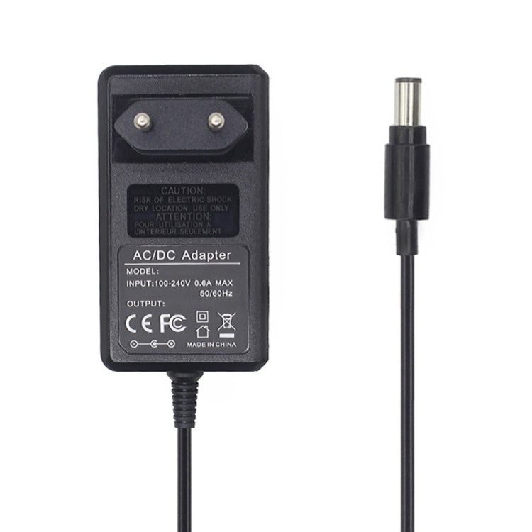 Black AC/DC charger adapter with prong plug facing and DC barrel connector