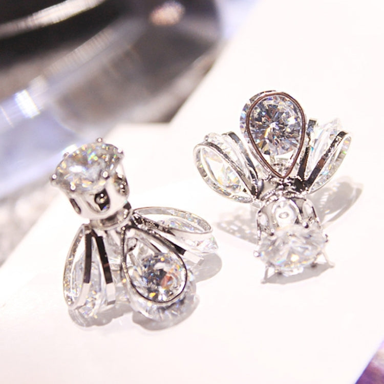 Silver crystal firefly drop earrings with clustered pear stones and wing-shaped accents