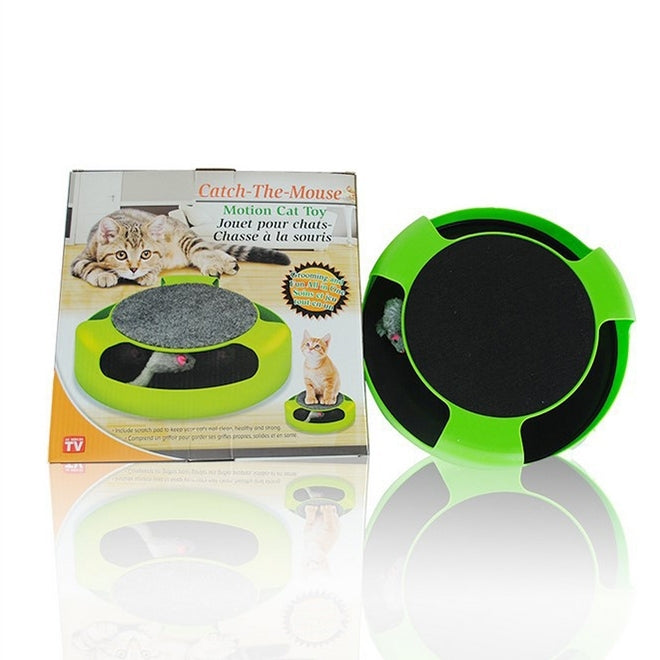 Green and black cat turntable toy with gray play surface in box.