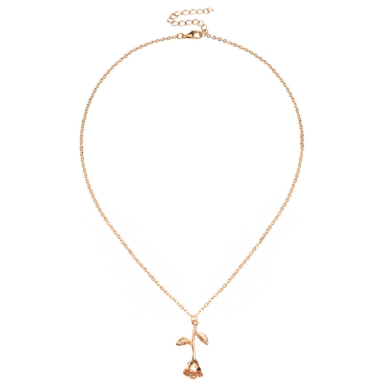 Rose-gold tone pendant necklace with branching floral charms and leaf details on a link chain