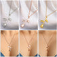 Rose pendant necklace with branching floral charms shown in silver, rose gold, and gold tones