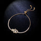 Gold hamsa hand bracelet with rhinestone chain and heart hamsa charm