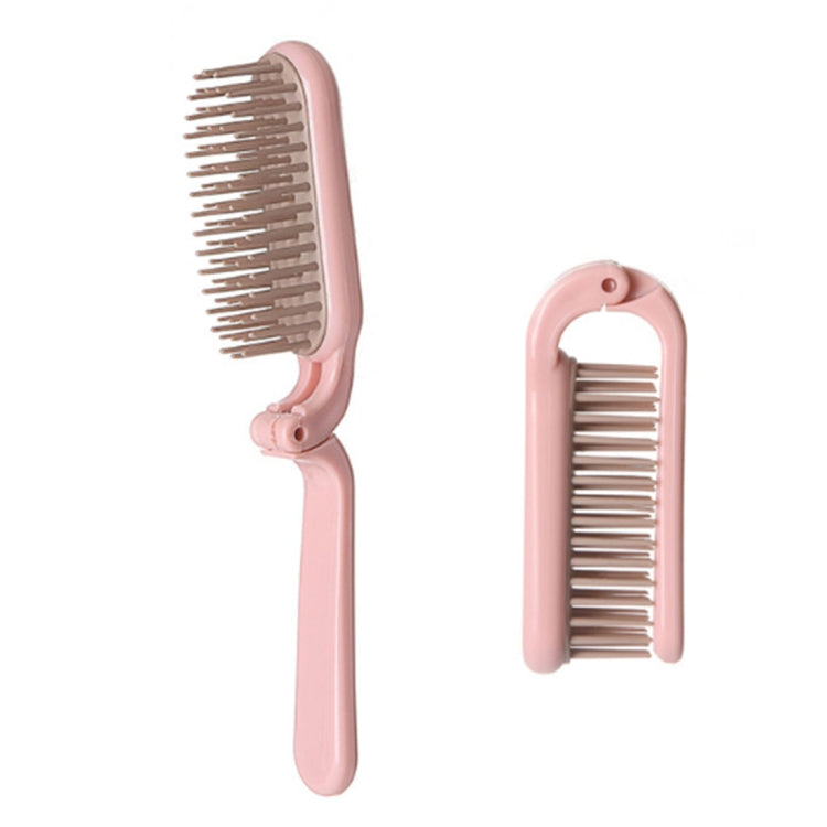 Pink folding hair comb with open bristle section and protective snap cover