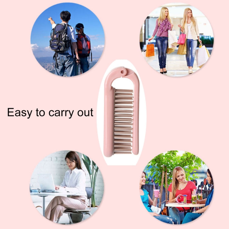 Pink folding hair comb with curved handle and snap-on protective cover