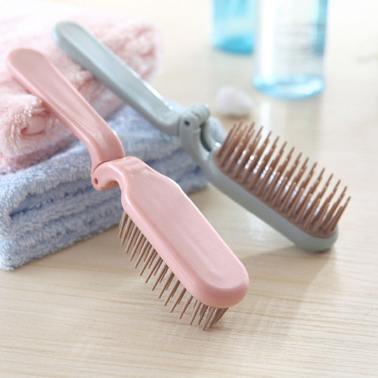 Pink and light-blue folding hair combs with fine bristle teeth