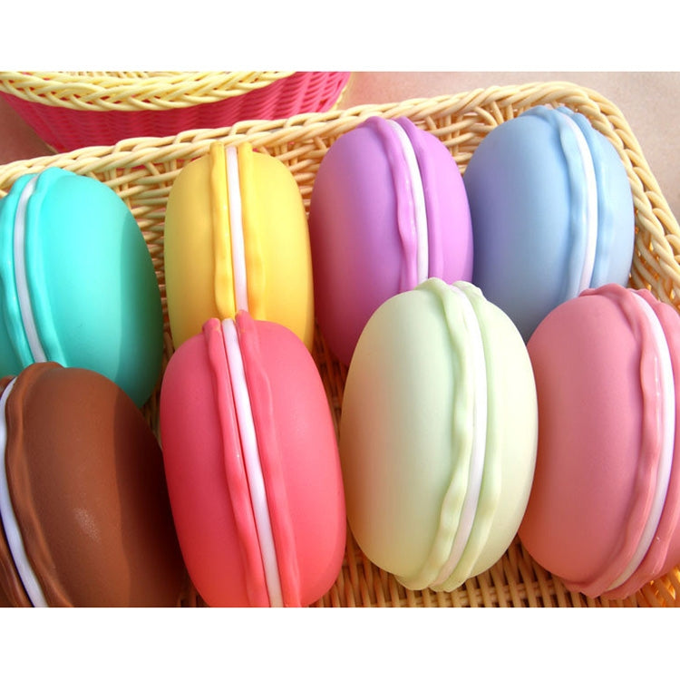 Macaron-style storage boxes in a wicker tray, assorted pastel colors