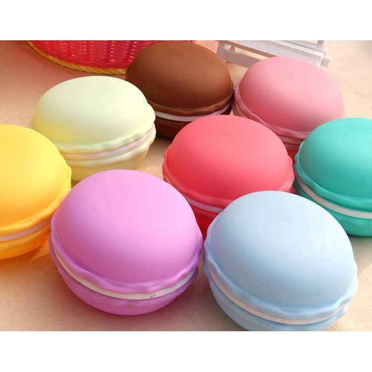Assorted pastel macaron-shaped storage boxes arranged in a cluster