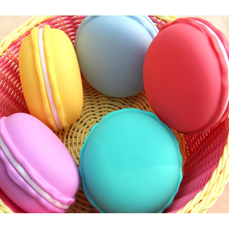 Colorful macaron-style storage boxes in a red basket, close-up
