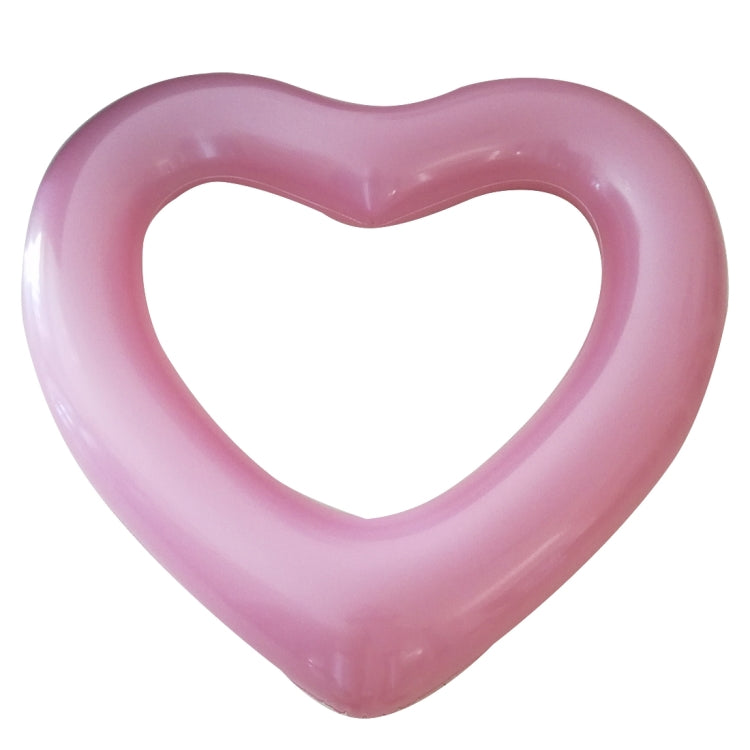 Pink heart-shaped inflatable pool ring with smooth rounded edges and inner heart cutout