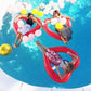 Red heart-shaped inflatable pool ring in water around people