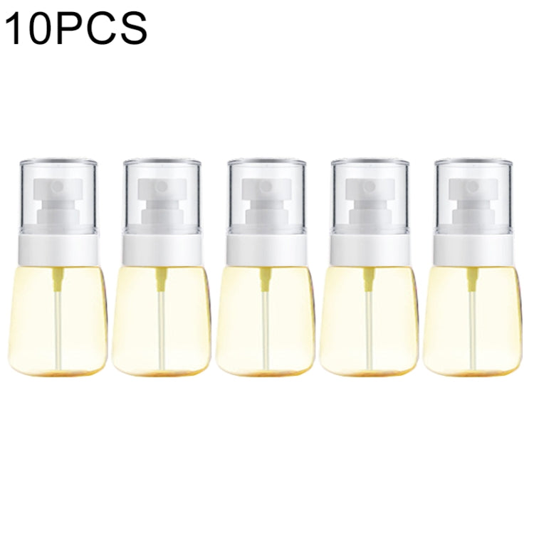 Set of 10 fine-mist spray bottles, transparent plastic with white pump heads and yellow liquid