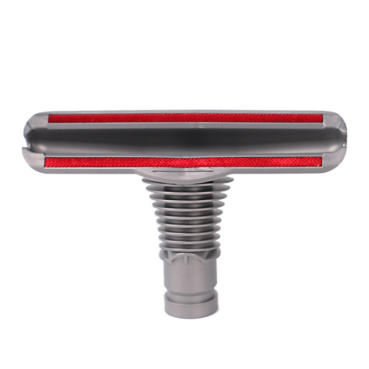Gray sofa and mattress vacuum brush head with red bristle strip, round nozzle