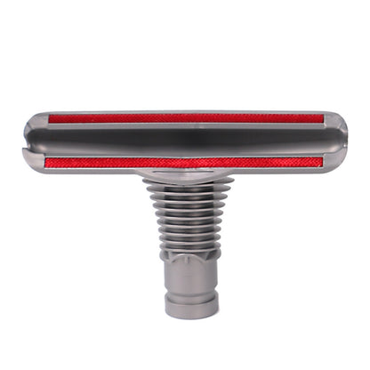 Gray sofa and mattress vacuum brush head with red bristle strip, round nozzle