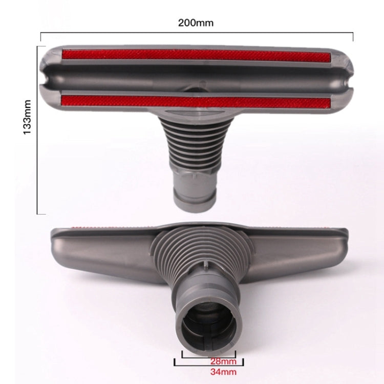 Squeegee-style carpet and floor tool with red strip and central roller, gray plastic