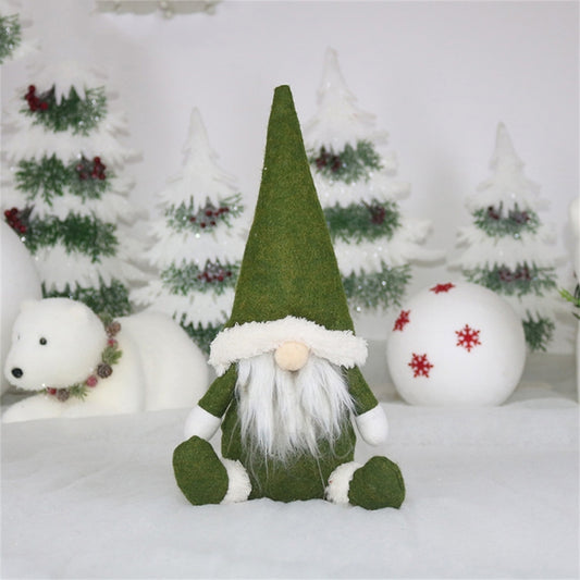 Green felt gnome window ornament with white fur-trimmed hat and long white beard