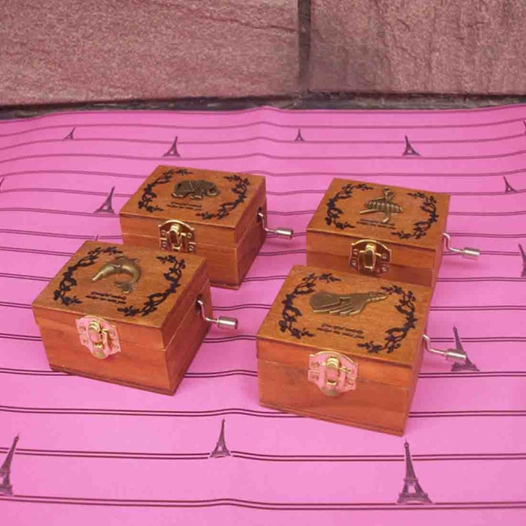 Set of four wooden music boxes with different engraved lids and pink locks
