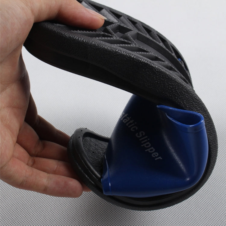 Blue PVC open-toe slipper with textured anti-skid outsole, close-up side view