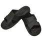 Black X-strap slide slippers with textured footbed and patterned non-slip outsole
