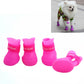 Pink waterproof rubber dog booties with strap cuffs, padded sole, set of two