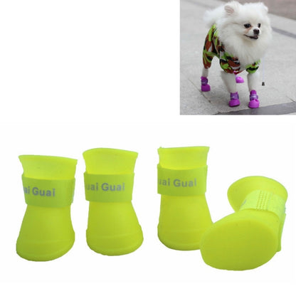 Purple rubber dog rain boots on a small dog