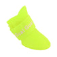 Lime green rubber dog rain boot with elastic cuff and mesh texture