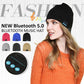 Black knitted beanie with Bluetooth control panel patch, shown on a model.