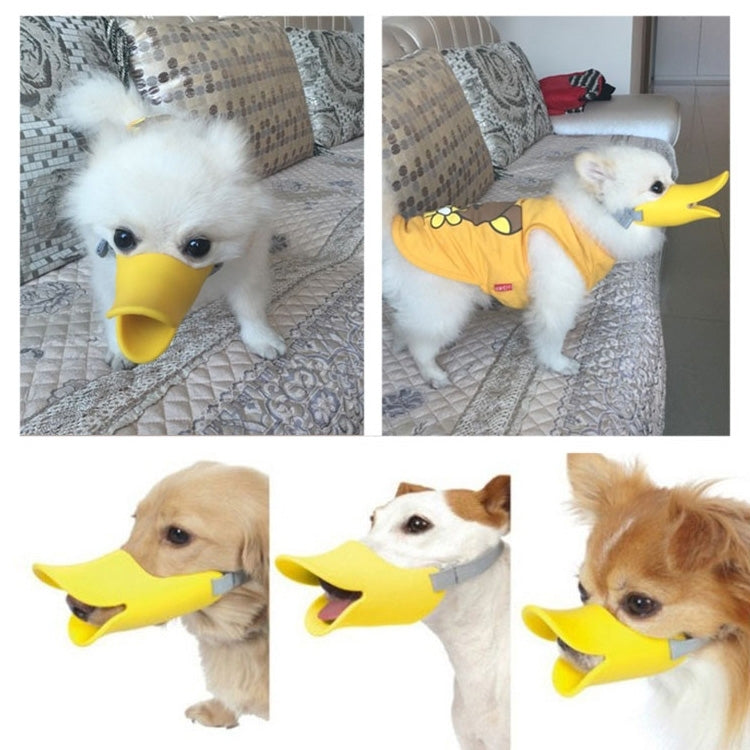 Yellow silicone duck-mouth muzzle with gray straps worn by small dogs
