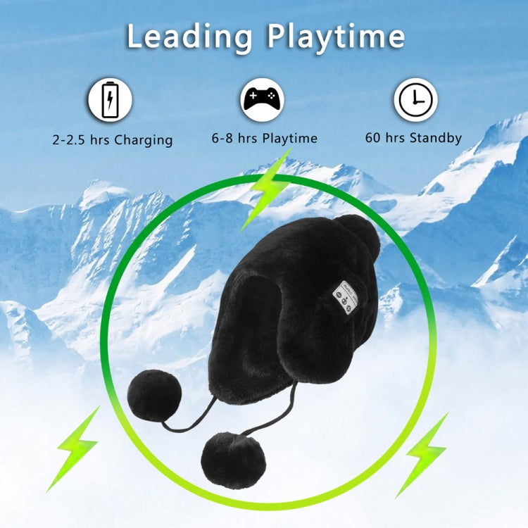 Black plush winter ear-muff hat with pom-poms and small control panel patch