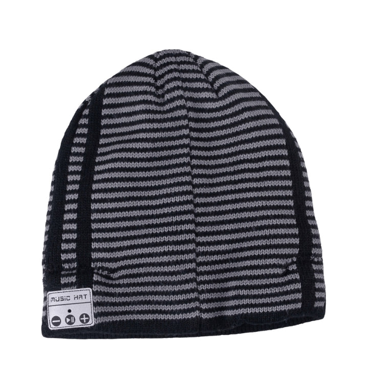 Black and gray striped knit beanie hat with fold-over cuff and control buttons