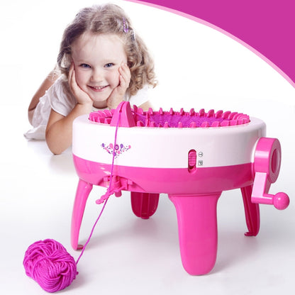 Pink kids knitting machine toy with yarn strand and colorful bobbins