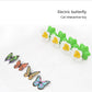 Electric butterfly cat interactive toy with green flower petals and four flying butterflies