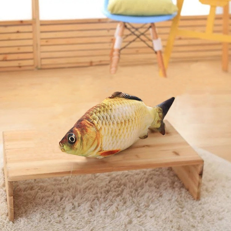 Fish-shaped cat scratching toy on a small wooden board, yellow plush scales