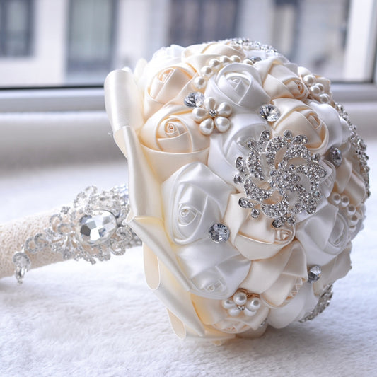 Ivory satin bouquet with rhinestone and pearl decorations, side view with handle ribbon