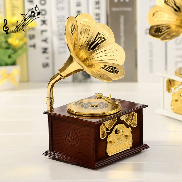 Gold-tone retro phonograph-style music box with open lid and gramophone horn