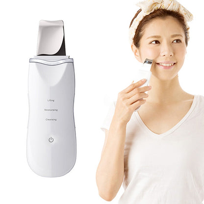White ultrasonic face cleansing machine with spatula head and power button