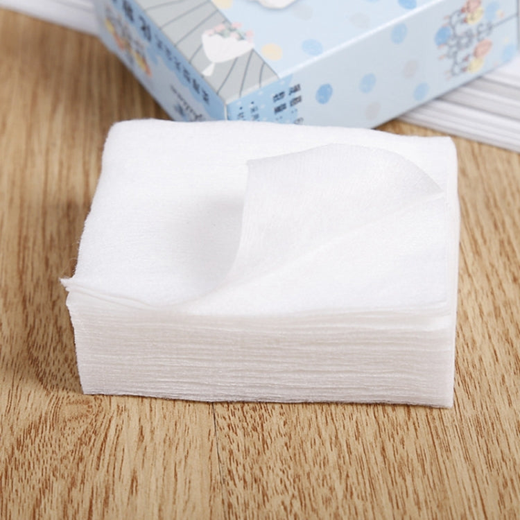 Stack of disposable white facial cotton puff pads