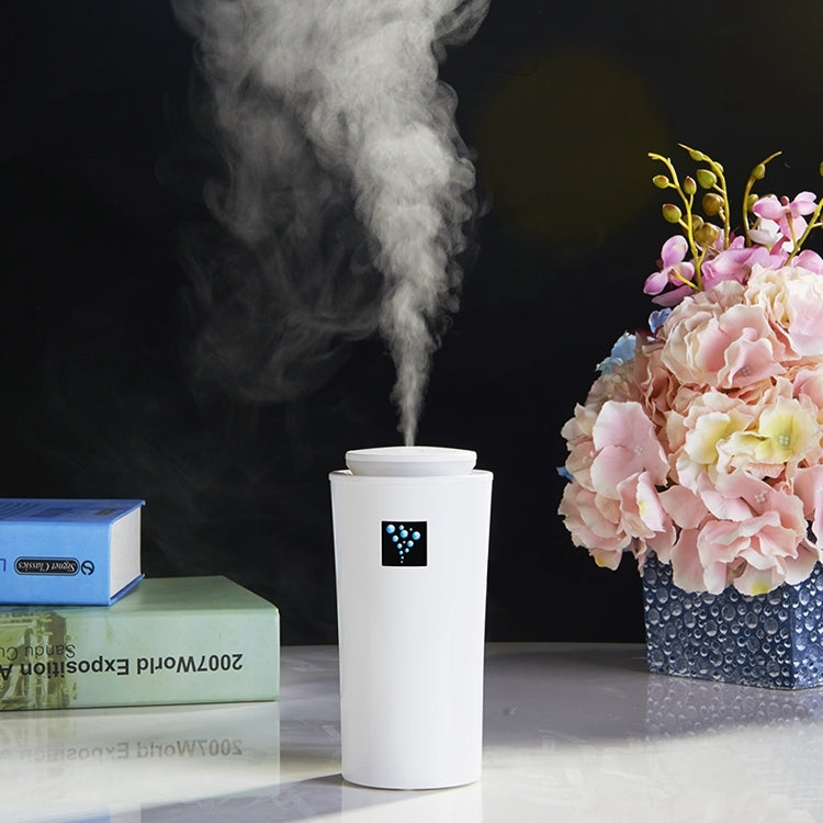 White humidifier cylinder with LED panel and rising mist