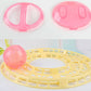 Pink hamster exercise ball halves with clear snap ring and base pieces.