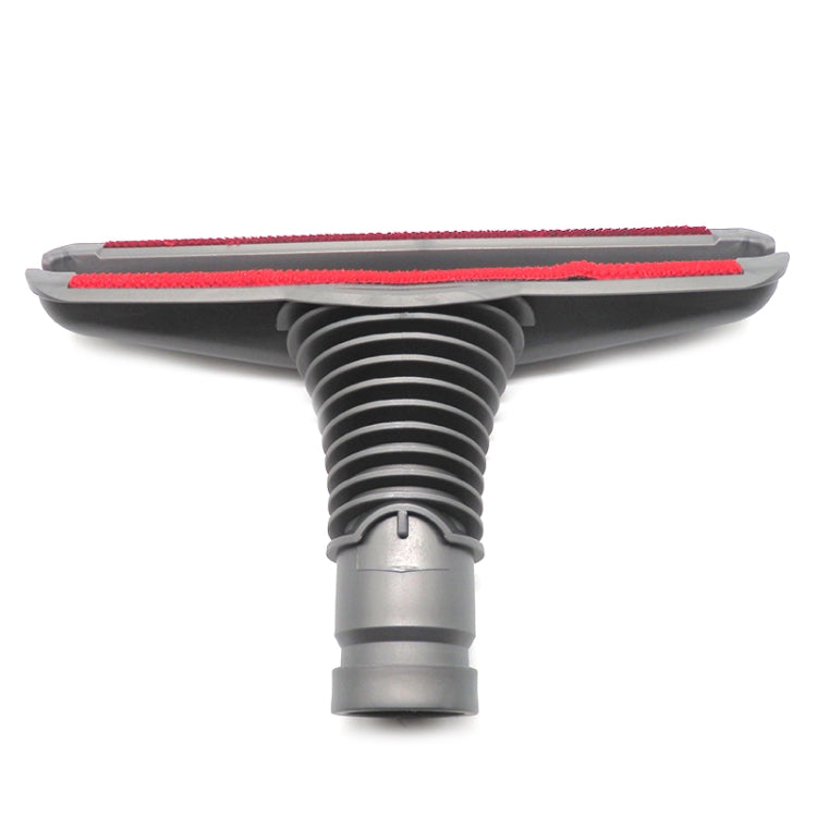 Upholstery bed tool with red-edged bristle strip and gray vacuum connector