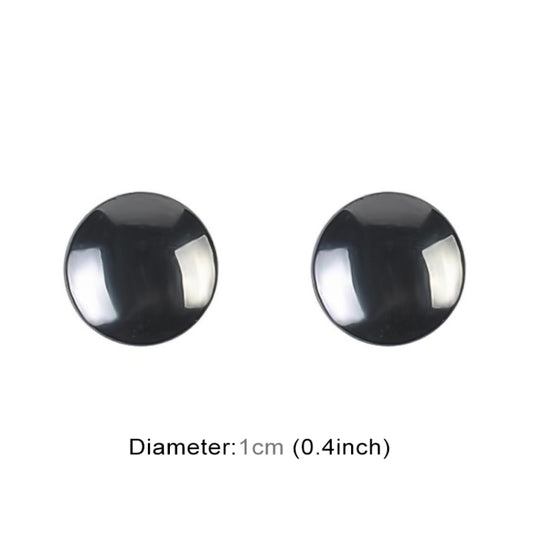 Round black magnetic earrings with reflective silver edge, two earrings shown