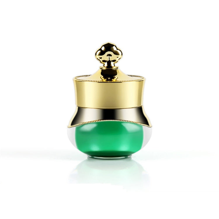 Gold travel container with green acrylic base and hard sealed lid