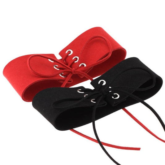 Two folded velvet lace-up chokers with grommets, red and black with tied laces