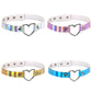 Four heart-shaped collar chokers in iridescent rainbow tones with metal heart clasps