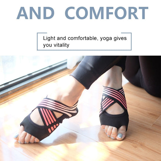 Pair of pink and black toeless yoga socks with striped non-slip grip, worn